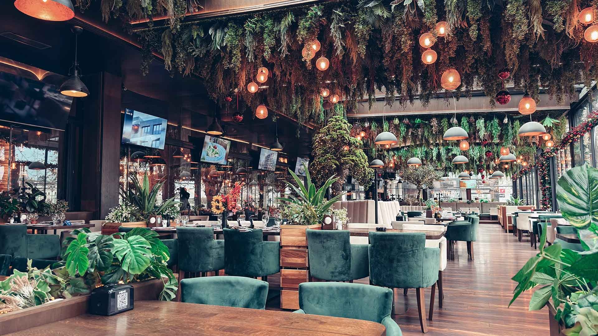 Soul Kitchen’s glass-walled riverside room hung with greenery